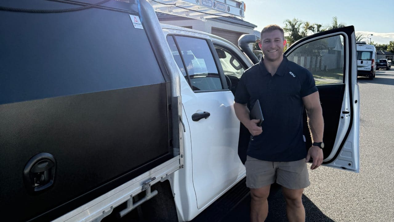Jamie Vesey, plumber at Vesey Plumbing Solutions, beside the work ute